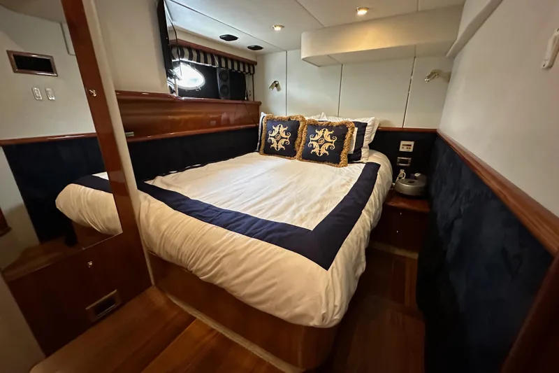 Slide: The Image of Luxurious bedroom interior of 2000 Sunseeker Predator 60 yacht with elegant bedding. - 74