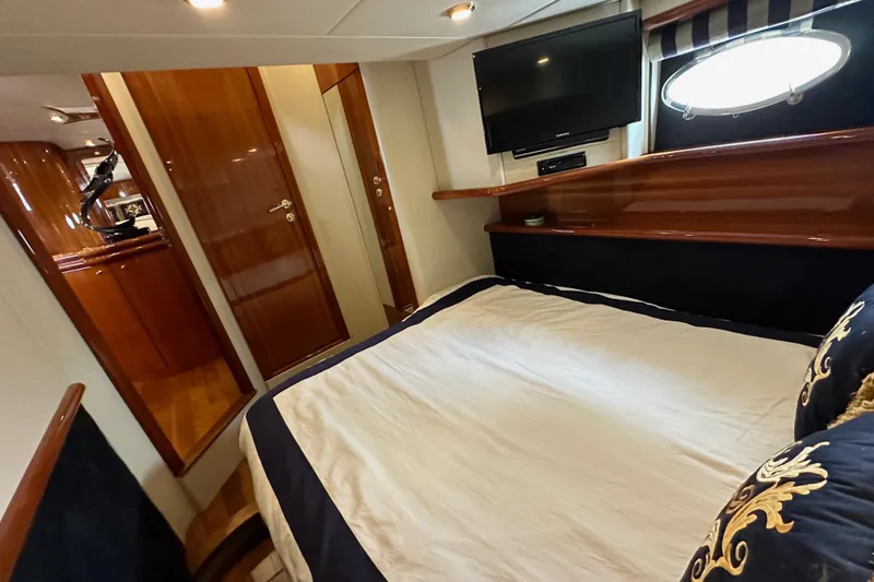 Slide: The Image of Luxurious cabin interior of 2000 Sunseeker Predator 60 yacht with elegant wood finishes. - 76