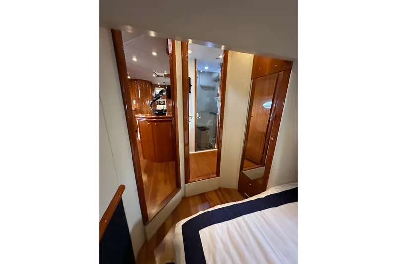 Slide: The Image of Interior of 2000 Sunseeker Predator 60 yacht with polished wood finishes and modern design. - 78