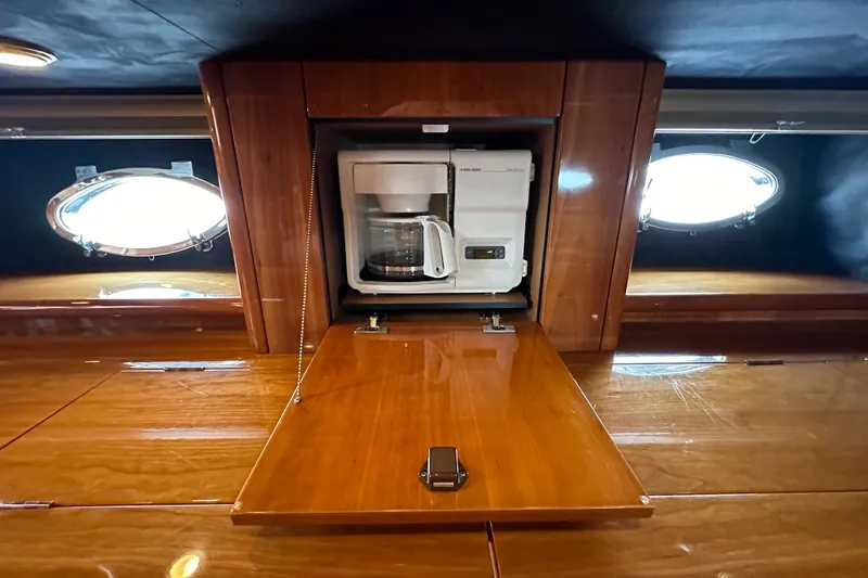 Slide: The Image of Coffee maker in wooden cabinet aboard 2000 Sunseeker Predator 60 yacht. - 90