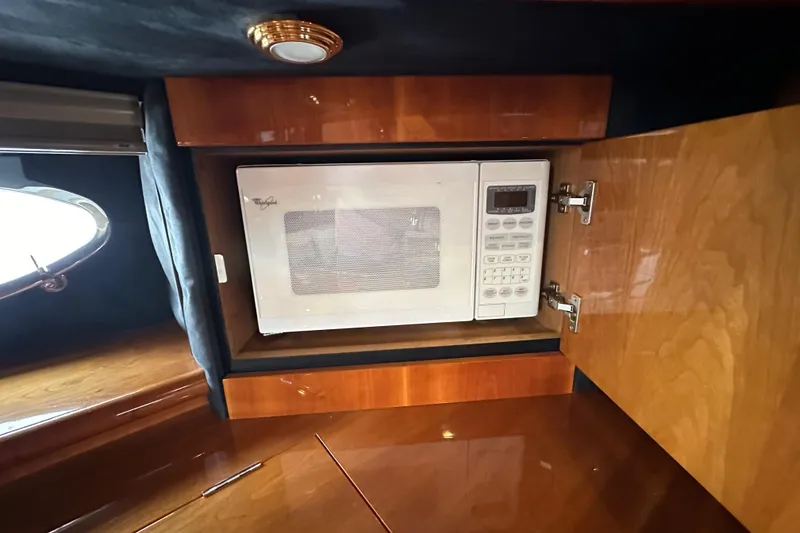 Slide: The Image of Microwave inside Sunseeker Predator 60 yacht's wooden cabinet, 2000 model. - 91