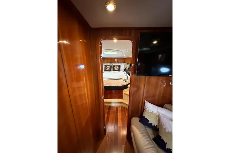 Slide: The Image of Luxurious cabin interior of 2000 Sunseeker Predator 60 yacht with wood paneling. - 96