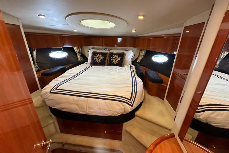 Slide: The Image of Luxurious bedroom interior of 2000 Sunseeker Predator 60 yacht with elegant bedding. - 97