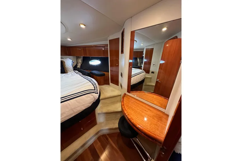 Slide: The Image of Luxurious cabin interior of 2000 Sunseeker Predator 60 yacht with elegant wood finishes. - 98