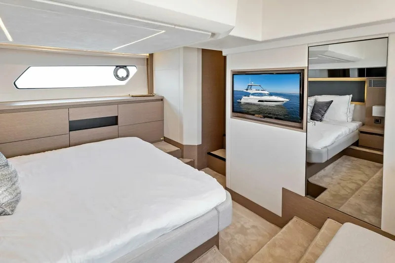Slide: The Image of Luxurious bedroom interior of 2023 Prestige 460 Flybridge yacht with modern design and TV. - 23