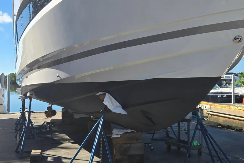 Slide: The Image of 2023 Prestige 460 yacht on stands, dockside maintenance view. - 70