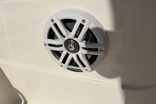 Slide: The Image of White speaker on 2016 Skeeter SX210 boat, mounted on a smooth surface. - 14