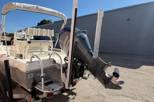 Slide: The Image of 2016 Skeeter SX210 boat with Yamaha outboard motor, parked outdoors. - 3