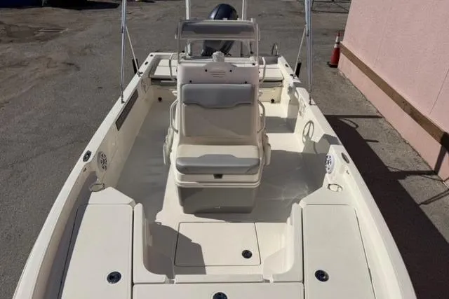 Slide: The Image of 2016 Skeeter SX210 boat interior with seating and storage compartments. - 5