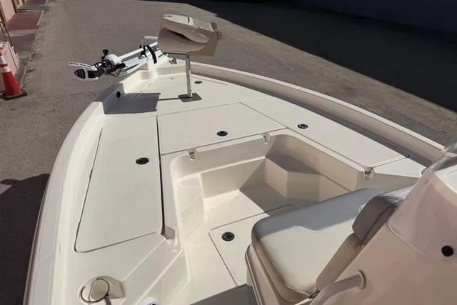 Slide: The Image of 2016 Skeeter SX210 boat deck with seating and storage compartments. - 6