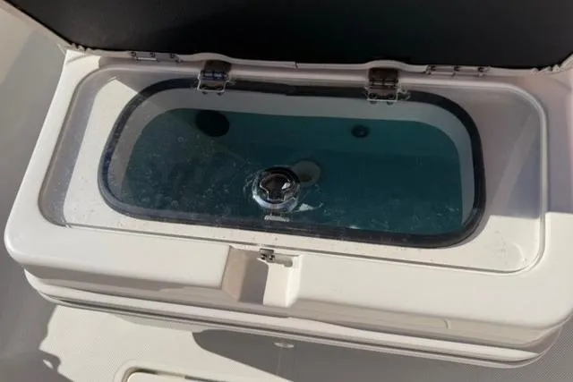 Slide: The Image of Livewell on a 2016 Skeeter SX210 boat, filled with water. - 7