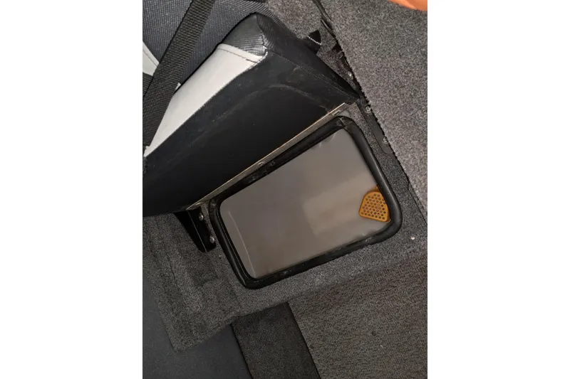 Slide: The Image of Storage compartment in 2015 Alumacraft Trophy 175 boat, featuring a secure latch. - 9