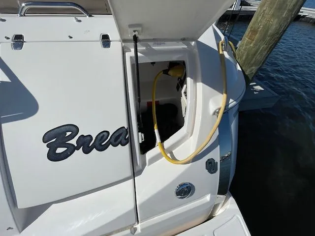 Slide: The Image of Regal 3550 Cuddy 2014 with open rear storage compartment. - 10