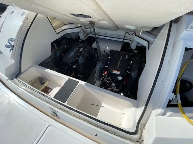 Slide: The Image of Engine compartment of a 2014 Regal 3550 Cuddy boat with dual engines. - 11