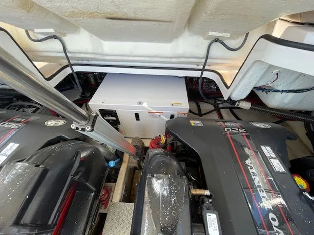 Slide: The Image of Engine compartment of a 2014 Regal 3550 Cuddy boat. - 16