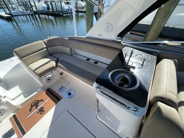 Slide: The Image of Interior of 2014 Regal 3550 Cuddy boat with seating and sink. - 20