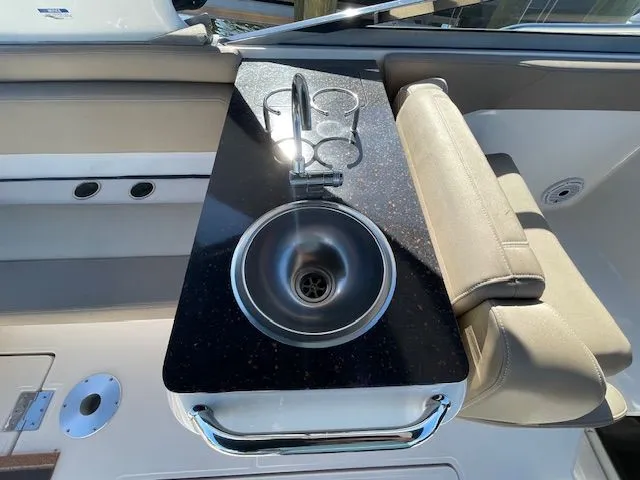 Slide: The Image of 2014 Regal 3550 Cuddy with sink and cup holders. - 24