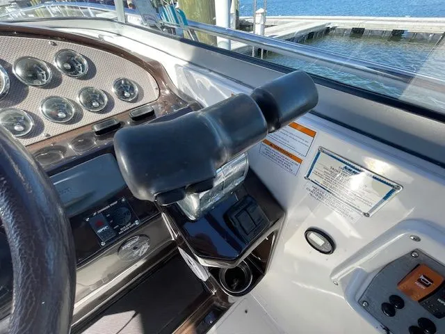 Slide: The Image of Helm console of a 2014 Regal 3550 Cuddy boat at the dock. - 30