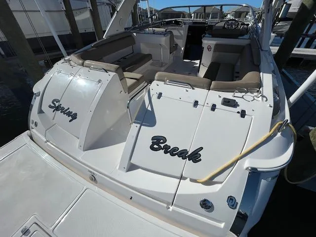 Slide: The Image of 2014 Regal 3550 Cuddy boat with "Spring Break" lettering. - 6
