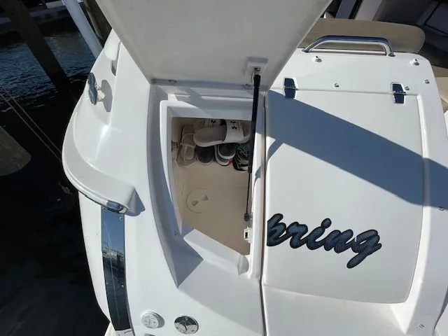 Slide: The Image of 2014 Regal 3550 Cuddy with open storage compartment at the stern. - 7