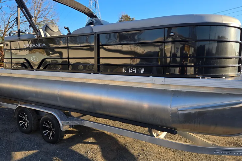 The Image of 2023 Veranda Vista View 20RC pontoon boat on trailer, side view. - 0