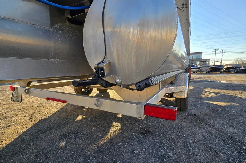 Slide: The Image of 2023 Veranda Vista View 20RC pontoon boat trailer detail in a sunny outdoor setting. - 11