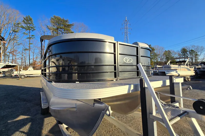 Slide: The Image of 2023 Veranda Vista View 20RC pontoon boat in a sunny outdoor setting. - 2