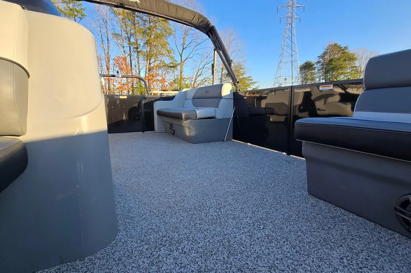 Slide: The Image of 2023 Veranda Vista View 20RC pontoon boat interior with gray seating and carpeted floor. - 22