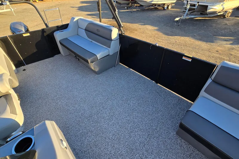 Slide: The Image of 2023 Veranda Vista View 20RC boat interior with gray seating and spacious deck. - 24