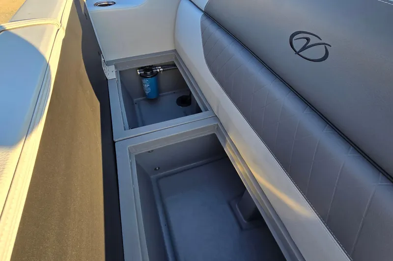 Slide: The Image of 2023 Veranda Vista View 20RC boat interior storage compartments with cup holder. - 30