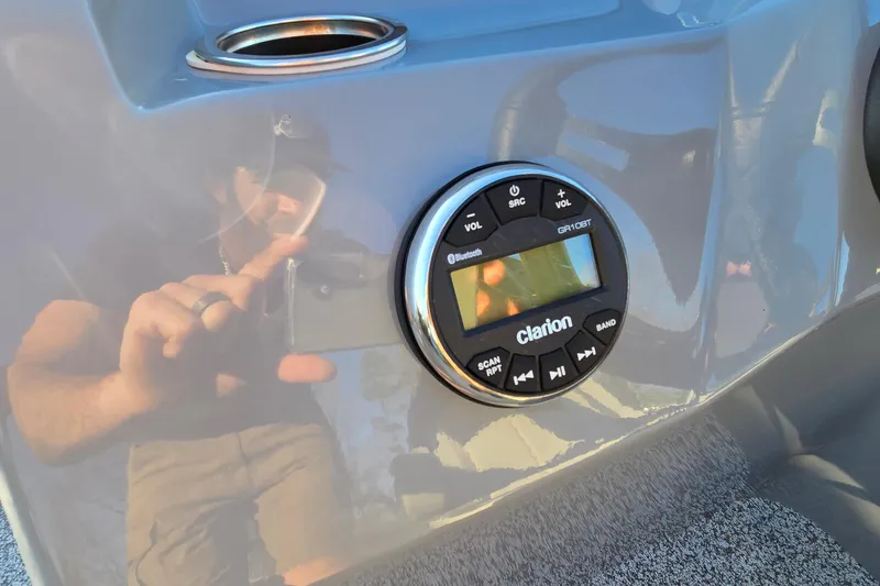 Slide: The Image of 2023 Veranda Vista View 20RC dashboard with Clarion audio system and cup holder. - 31