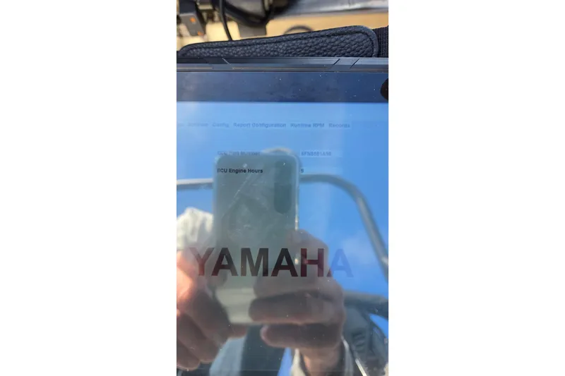 Slide: The Image of Reflection on a Yamaha display screen showing ECU engine hours on a Veranda Vista View 20RC, 2023. - 42