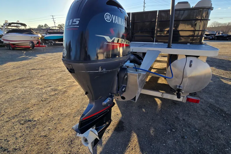 Slide: The Image of 2023 Veranda Vista View 20RC with Yamaha outboard motor in a boatyard. - 7