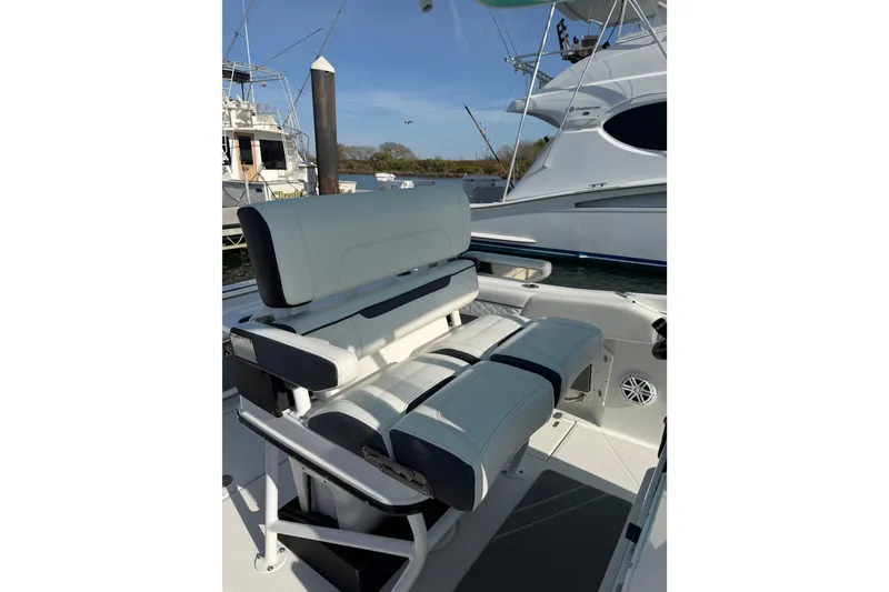 Slide: The Image of 2021 Blackfin 252 CC boat seating area with modern design and comfortable upholstery. - 13