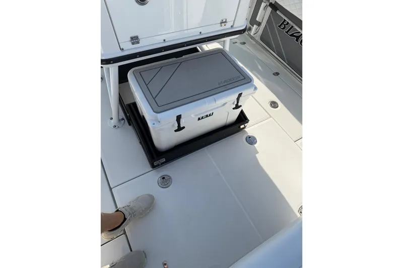 Slide: The Image of 2021 Blackfin 252 CC boat deck with cooler storage compartment. - 15