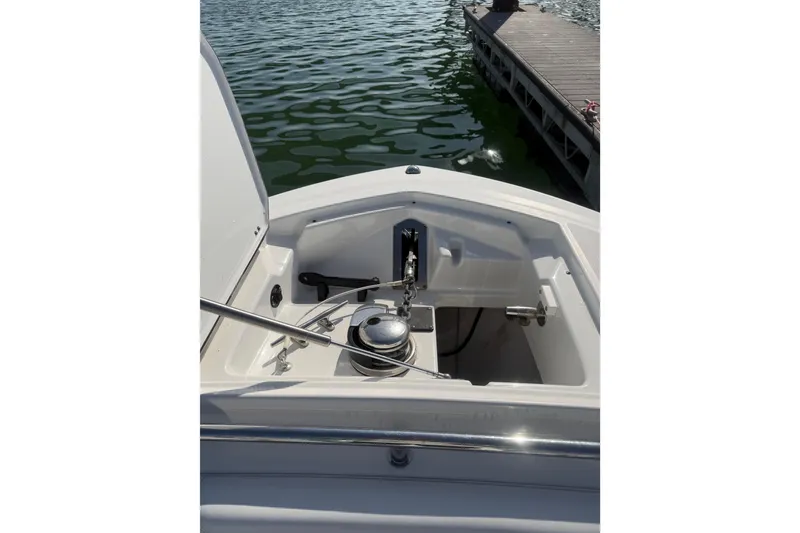 Slide: The Image of 2021 Blackfin 252 CC boat anchor compartment at dockside. - 3