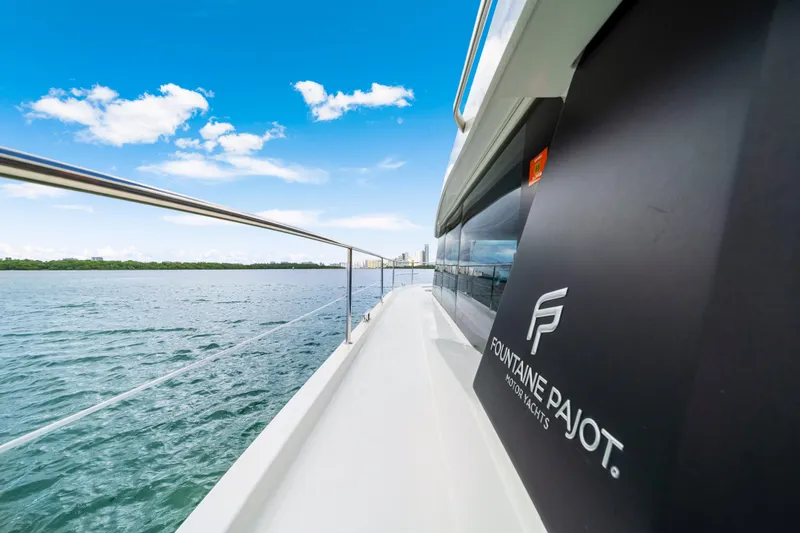 Slide: The Image of 2023 Fountaine Pajot MY4.S yacht cruising on a sunny day, showcasing sleek design. - 11