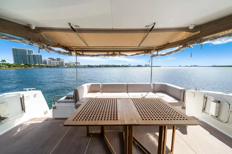 Slide: The Image of Luxurious 2023 Fountaine Pajot MY4.S yacht deck with scenic waterfront view. - 17