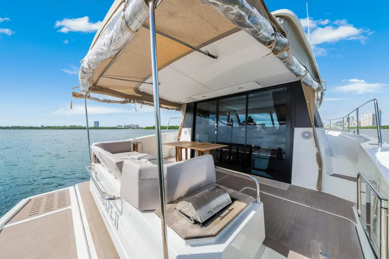 Slide: The Image of 2023 Fountaine Pajot MY4.S yacht deck with seating and ocean view. - 20