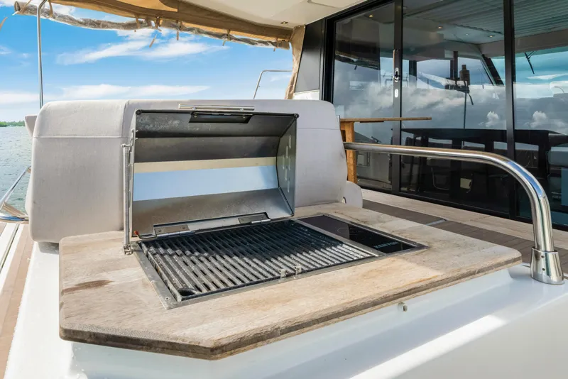 Slide: The Image of Outdoor grill on 2023 Fountaine Pajot MY4.S yacht deck, with ocean view. - 24