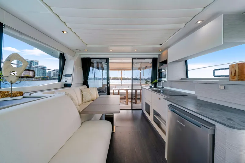 Slide: The Image of Luxurious interior of 2023 Fountaine Pajot MY4.S yacht with modern kitchen and seating area. - 25