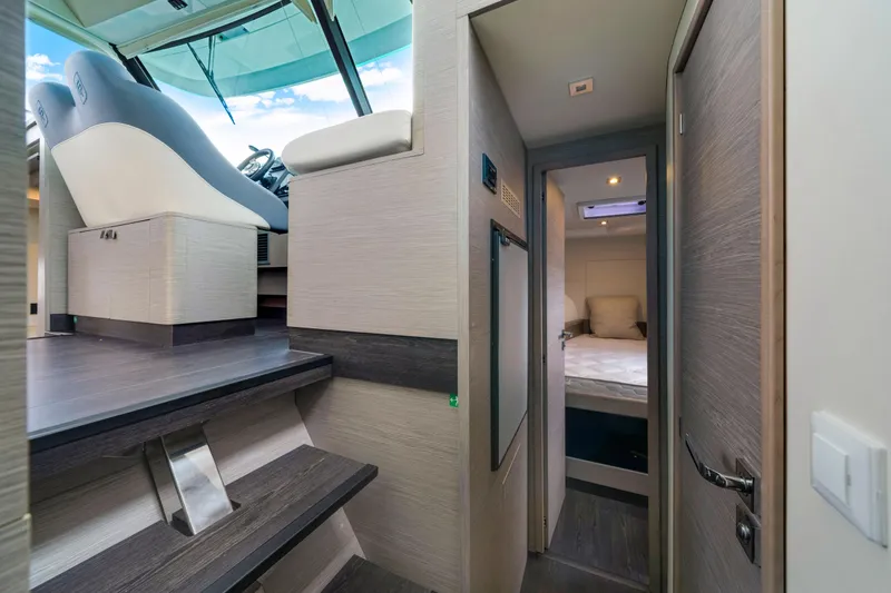 Slide: The Image of Interior of 2023 Fountaine Pajot MY4.S yacht, featuring helm and cozy cabin. - 33