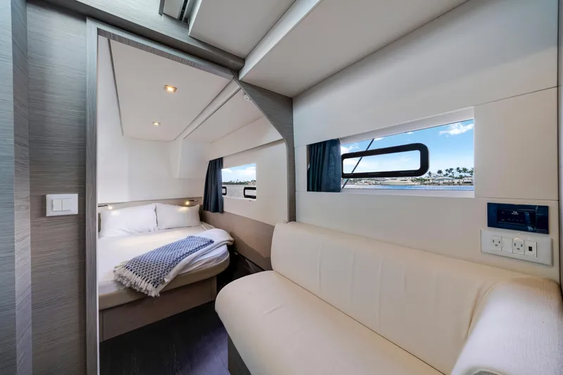 Slide: The Image of Luxurious interior of 2023 Fountaine Pajot MY4.S yacht with cozy bedroom and scenic window view. - 35