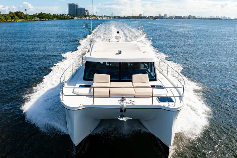 Slide: The Image of 2023 Fountaine Pajot MY4.S yacht cruising on open water, showcasing sleek design and luxury. - 6