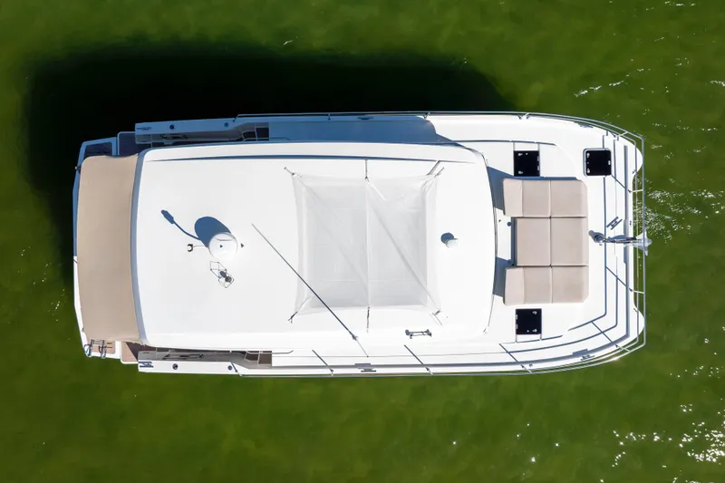 Slide: The Image of Top view of 2023 Fountaine Pajot MY4.S yacht on green water. - 7