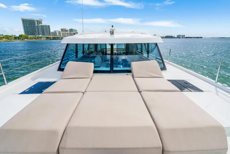 Slide: The Image of 2023 Fountaine Pajot MY4.S yacht with sun loungers on deck, ocean view. - 9