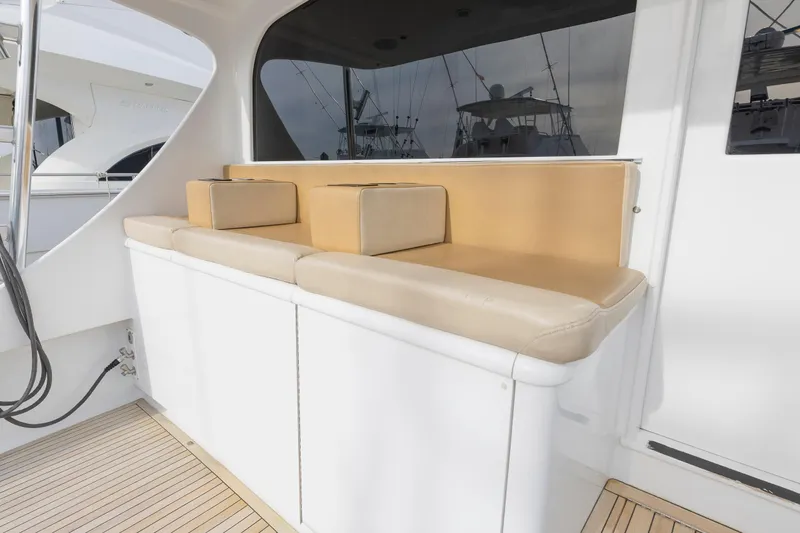 Slide: The Image of Spacious deck of 2005 Weaver 61 yacht with fishing chair and seating area. - 11