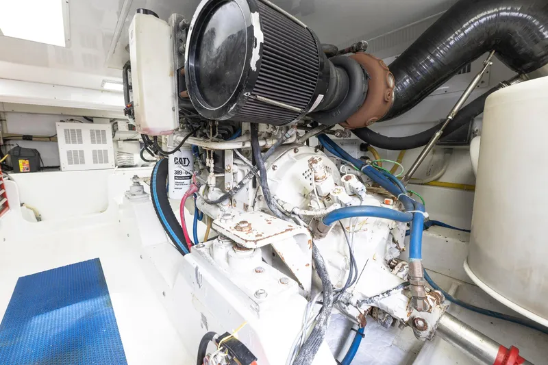 Slide: The Image of Luxury Weaver 61 yacht deck, 2005 model, docked at marina with fishing equipment. - 15