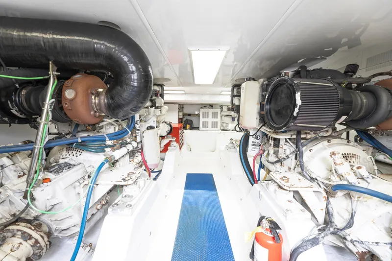 Slide: The Image of Luxury Weaver 61 yacht cruising on open water, 2005 model, with fishing rods. - 16