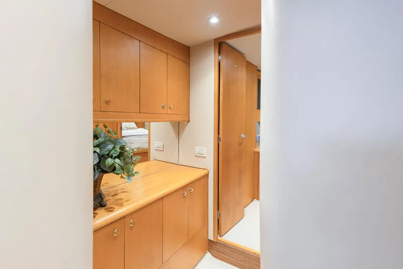 Slide: The Image of Luxurious bathroom in 2005 Weaver 61 yacht with modern fixtures and wooden cabinetry. - 24